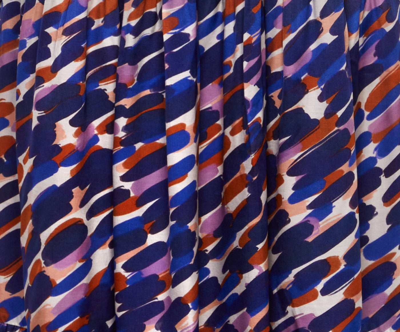 fabric print in blue purple and orange on white background