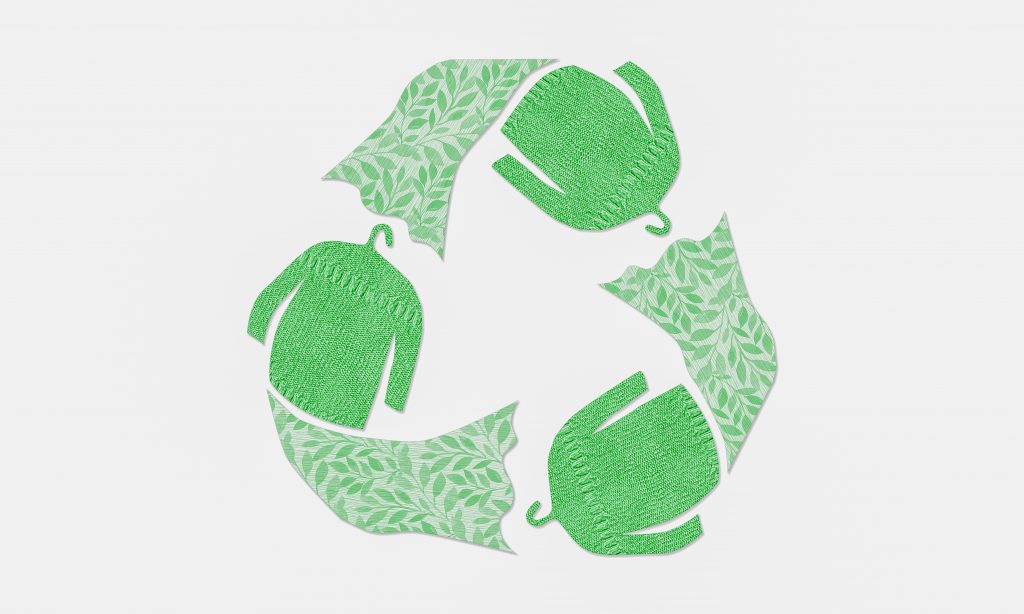 Green recycle arrow symbol with clothes
