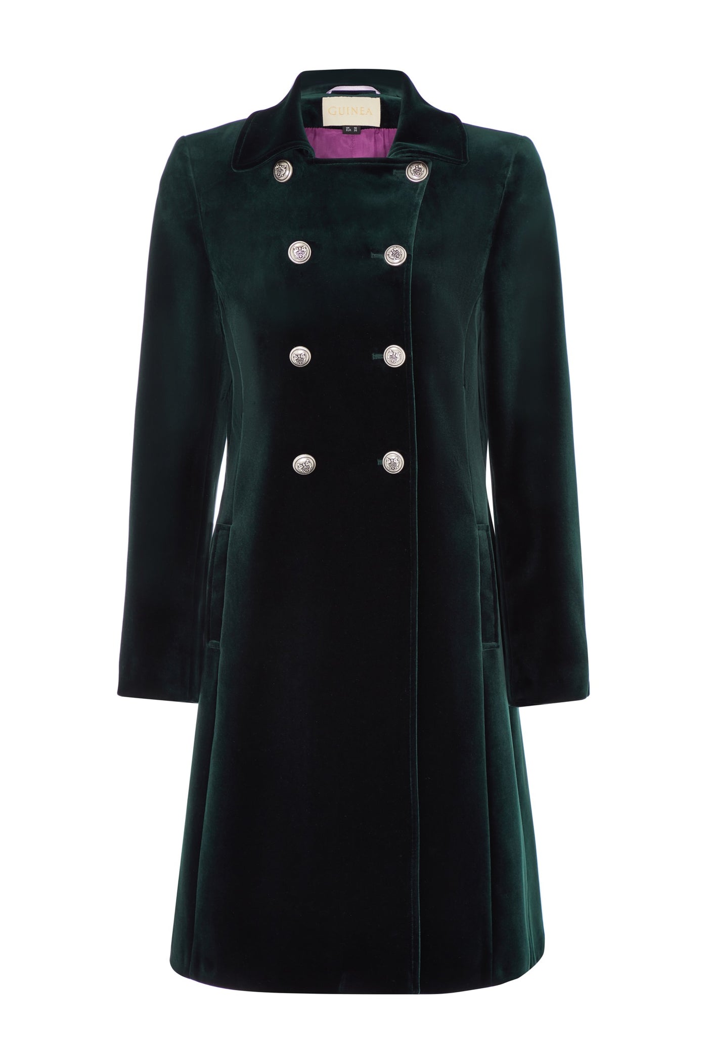 Women's mid length coat in dark green velvet. The coat has a classic military style with double breasted silver buttons