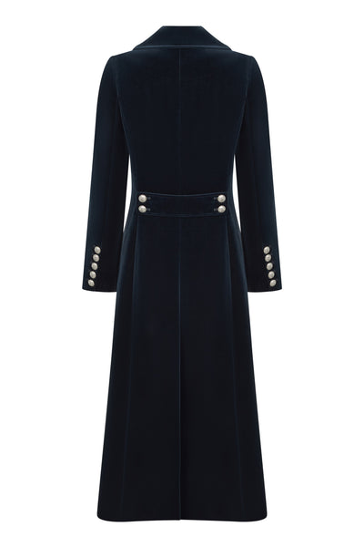 Women's long navy velvet coat with military style silver buttons.