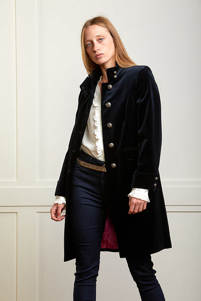 Womens navy velvet boho coat with high collar, silver buttons and elegant tailoring.