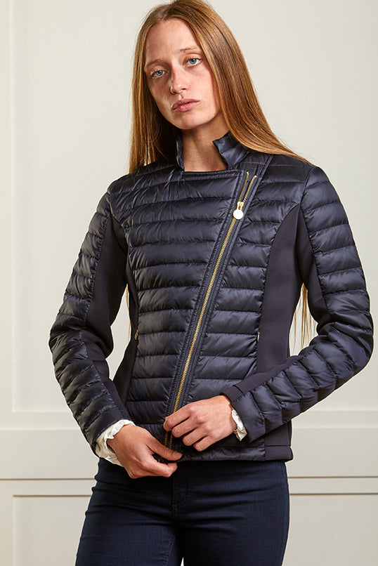 Women's navy biker jacket in a puffer style with stretch side panels.