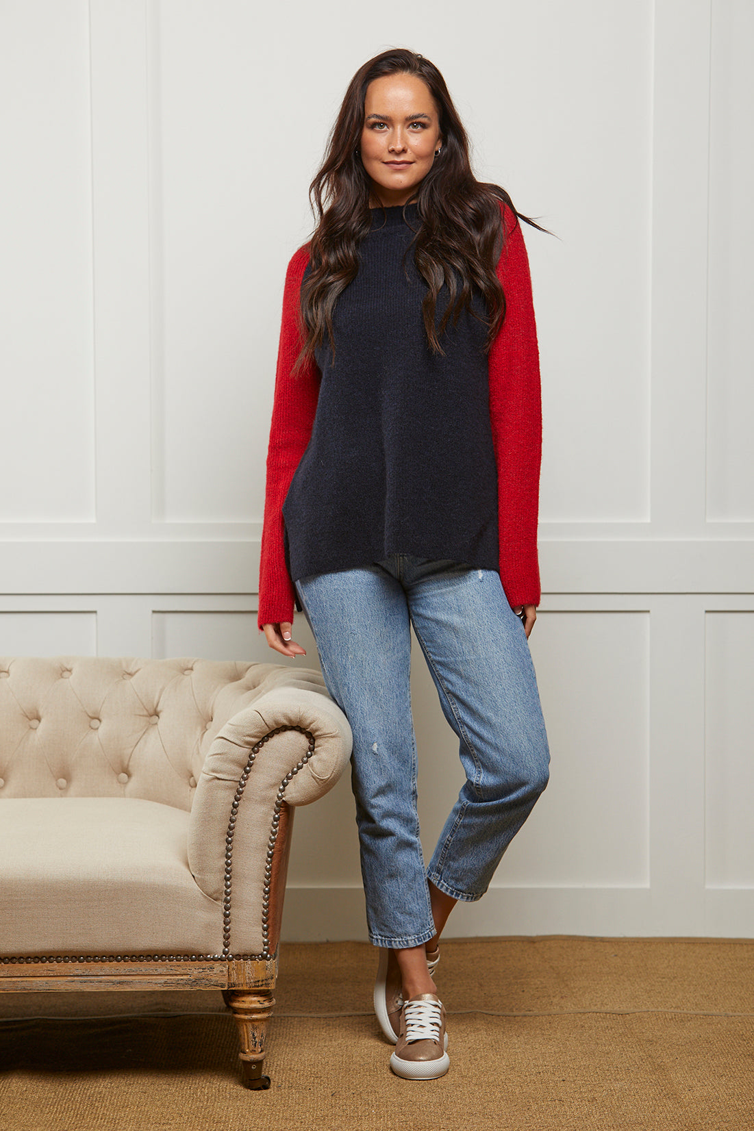 Relaxed fit women's navy and red jumper. This wool blend jumper has navy body and contrast red sleeves.