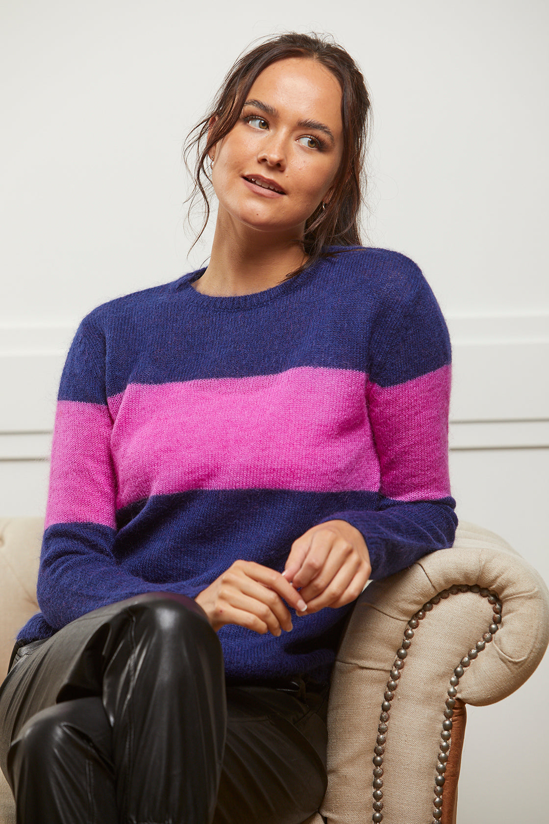 Navy jumper with pink stripe in a wool and mohair blend. It has a relaxed fit and crew neck