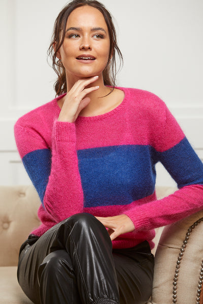 Pink jumper with dark blue band to body and sleeves. Crafted in a wool and mohair blend.