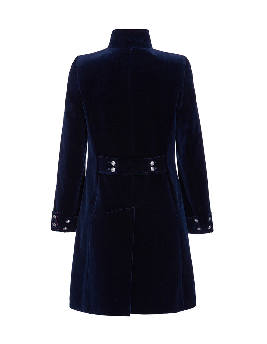 Back view detail of a navy velvet coat with silver button details to the back and cuffs