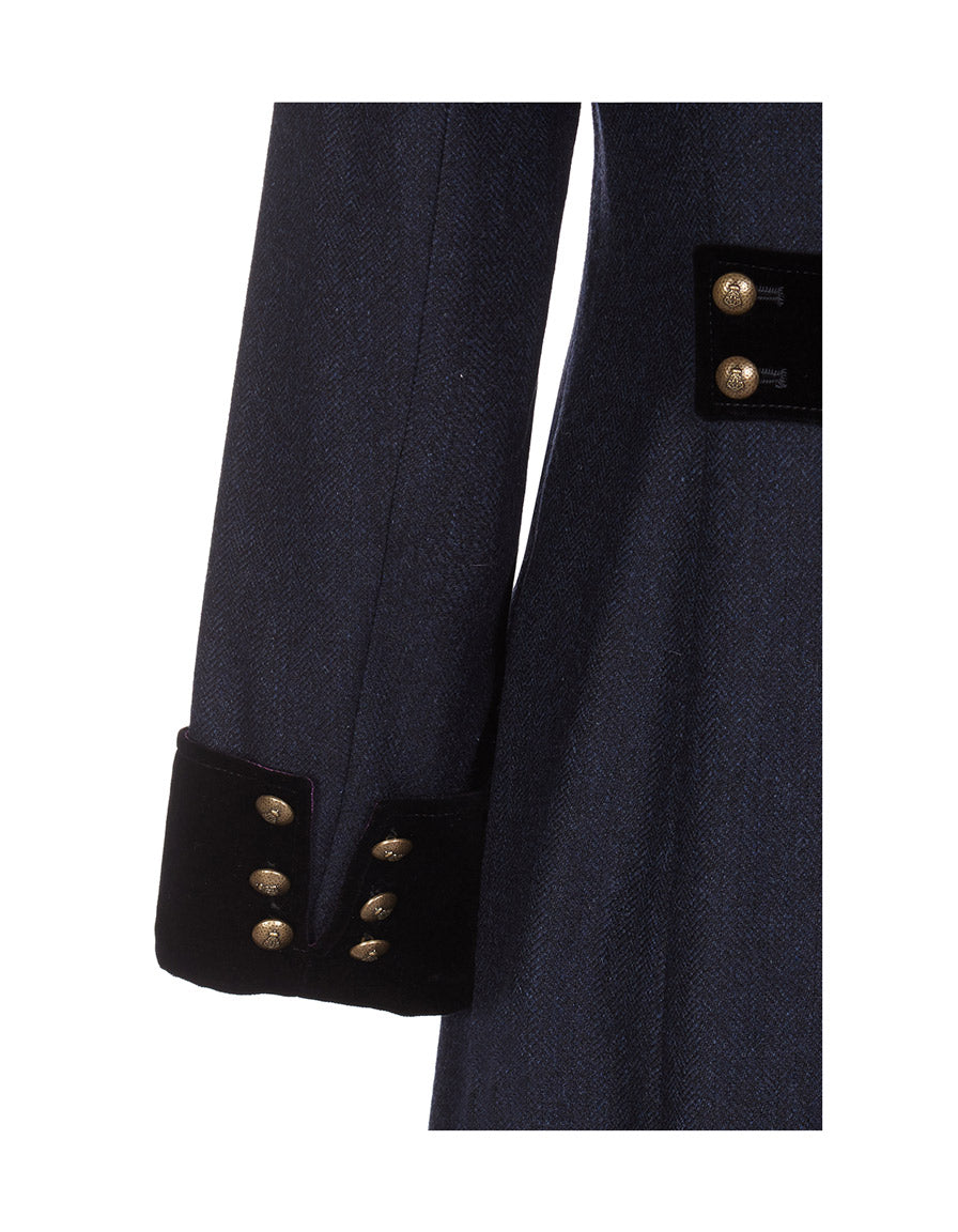 Long navy wool coat sleeve detail with velvet cuff and military buttons